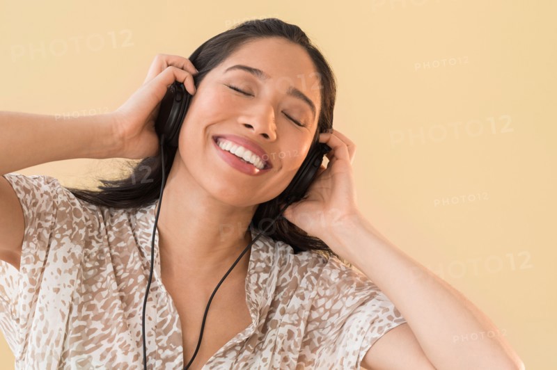 Young woman listening to music.
