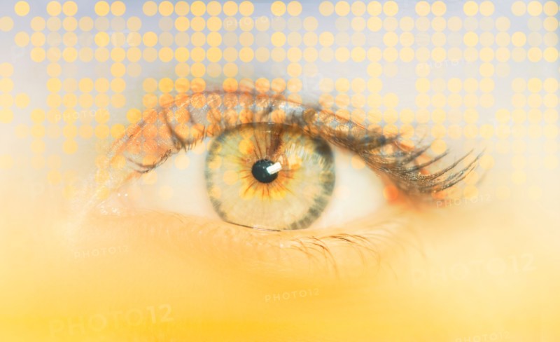 Close-up of female eye with digital pattern.