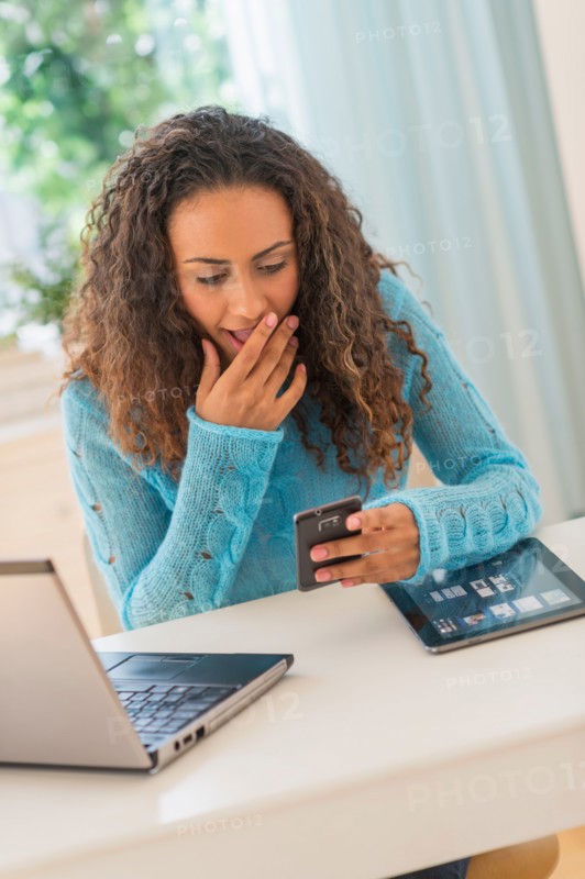 Young woman in home office.