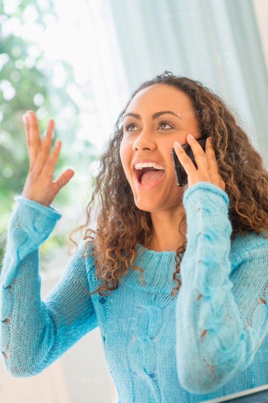 Young woman talking on phone.