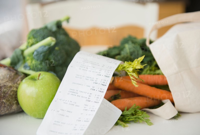 Fresh vegetables with store bill