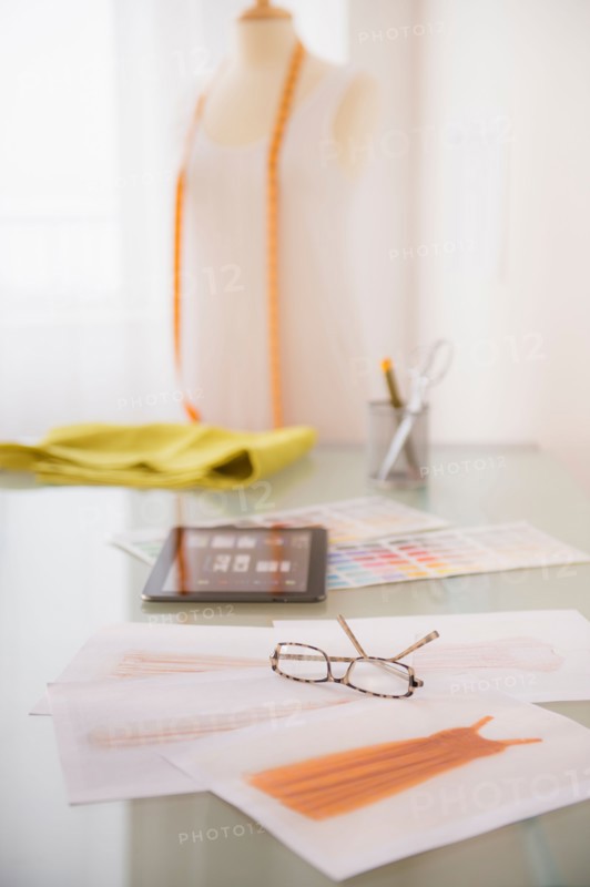 View of digital tablet, sketch and spectacles