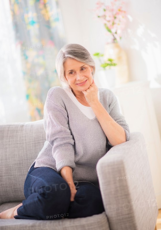 Portrait of woman relaxing on sofa