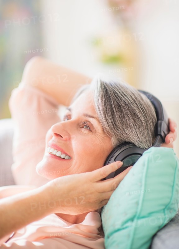 Portrait of woman listening to music