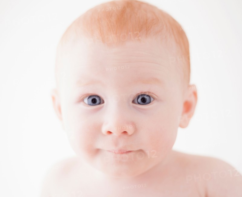 Studio shot portrait of surprised baby boy (18-23 months)