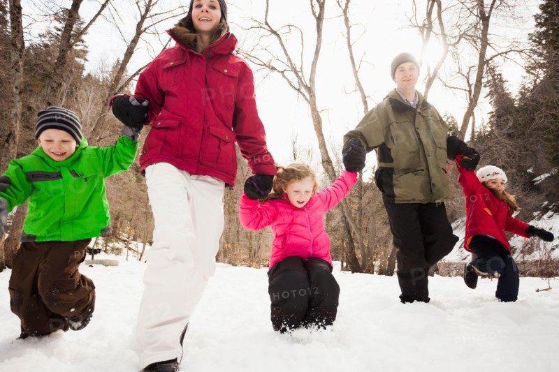 Three children (2-3, 4-5) with parents during stroll