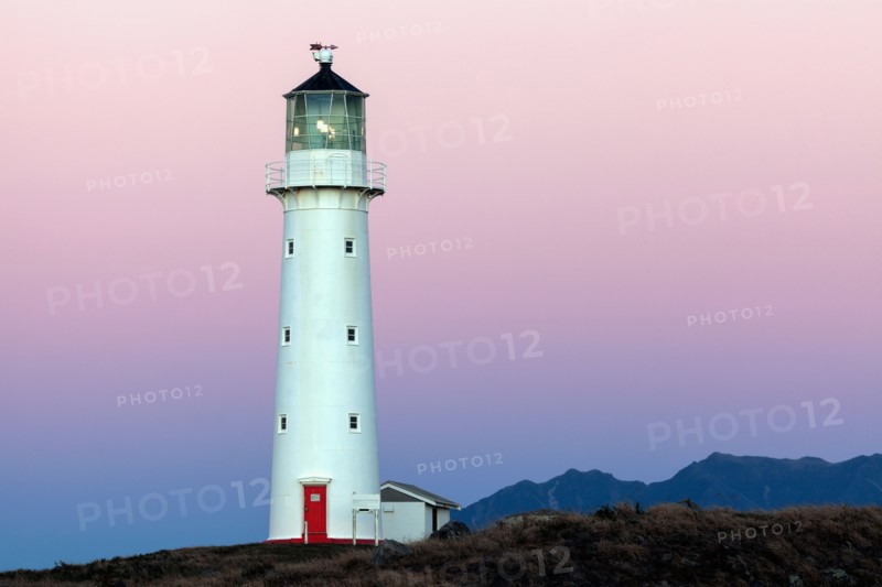 Lighthouse with Taranaki volcano in background