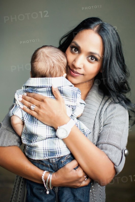Mother holding her son (2-5 months)