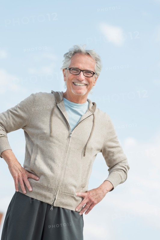 Portrait of senior man standing outdoors.