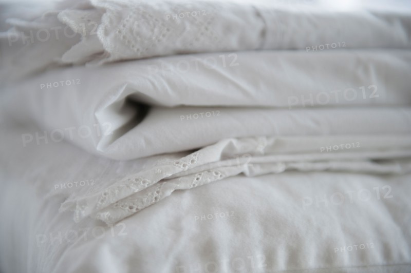 Close up of folded white sheets, studio shot