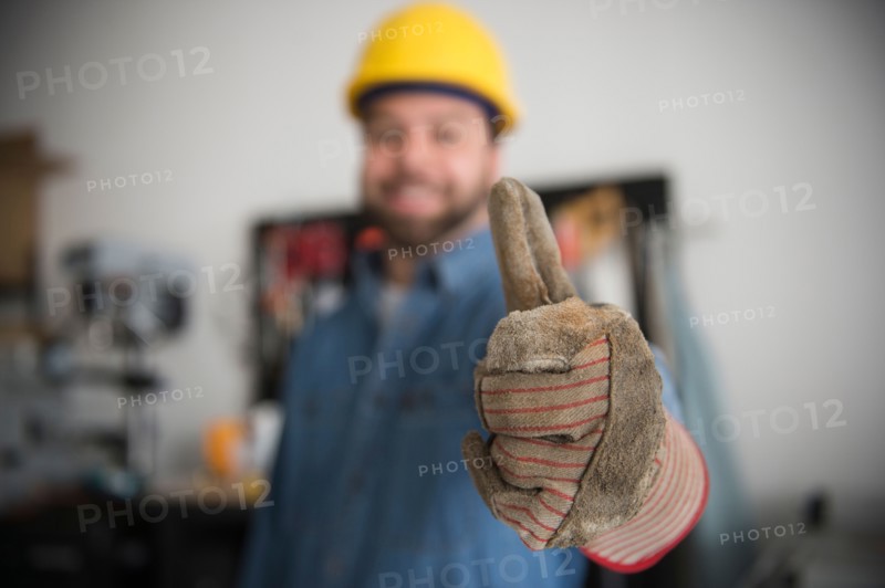 Construction worker with thumb up