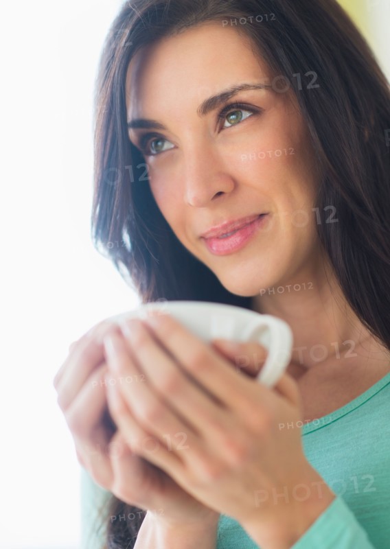 Woman with cup in hand