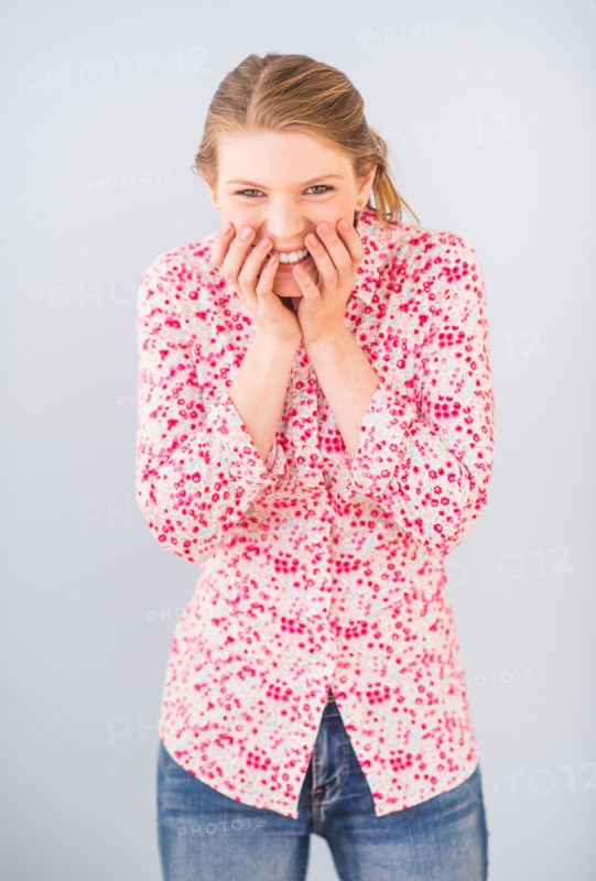 Woman with head in hands
