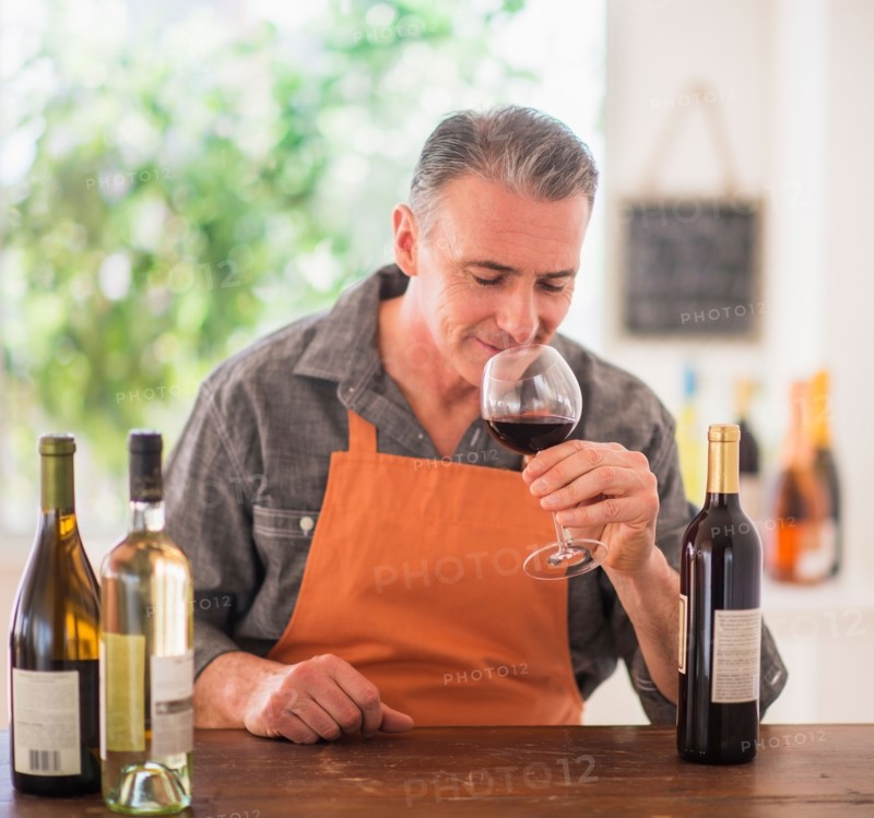 Portrait of man tasting wine