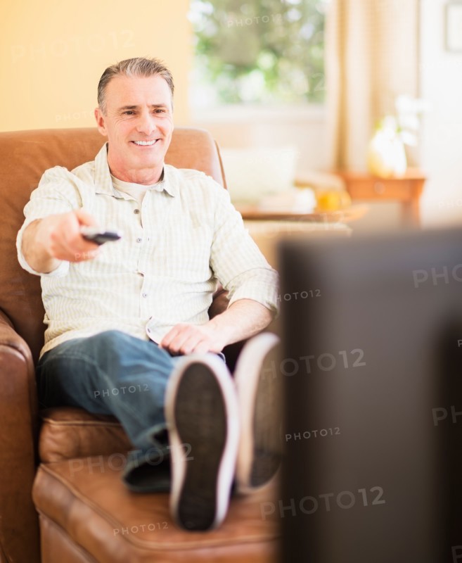 Portrait of man watching tv