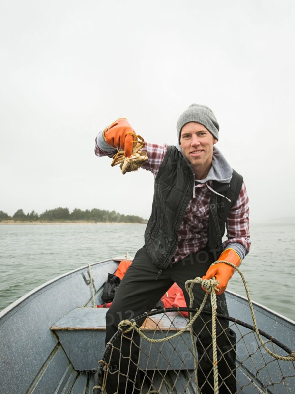 Portrait of man showing crab