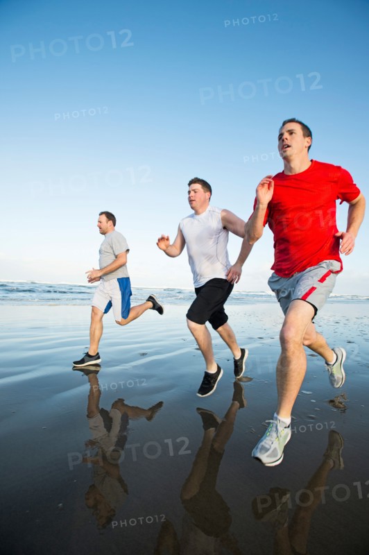 Men running on beach