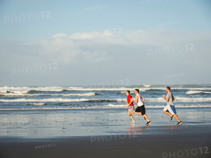 Men running on beach