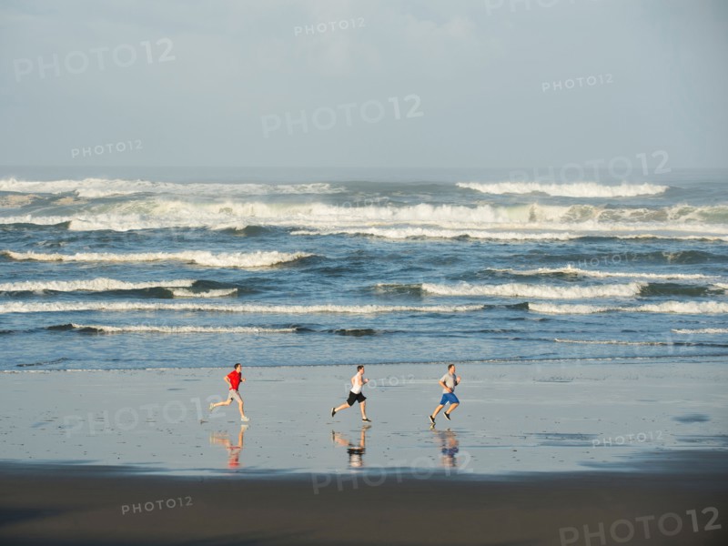 Men running on beach