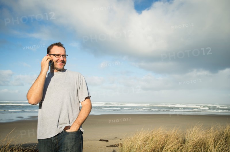 Mid adult man taking photograph