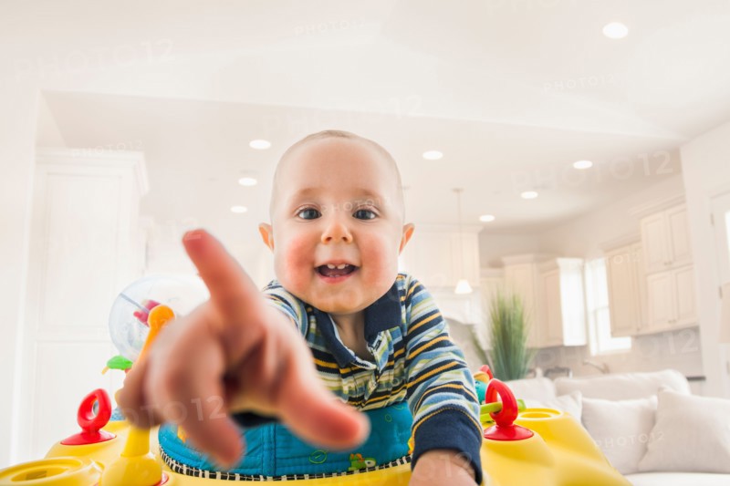 Portrait of baby (18-23 months) pointing