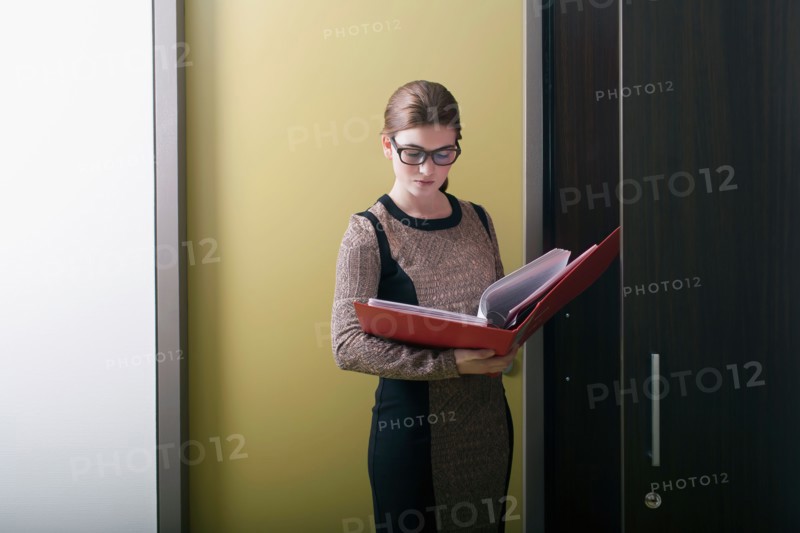 Businesswoman reading files