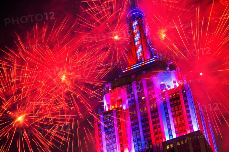 New York City, New York. Empire state building with firework display.