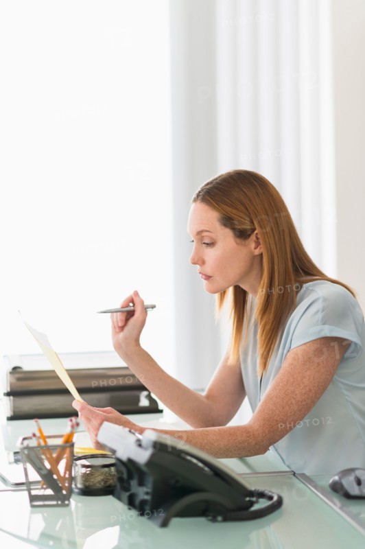 Business woman working in office.