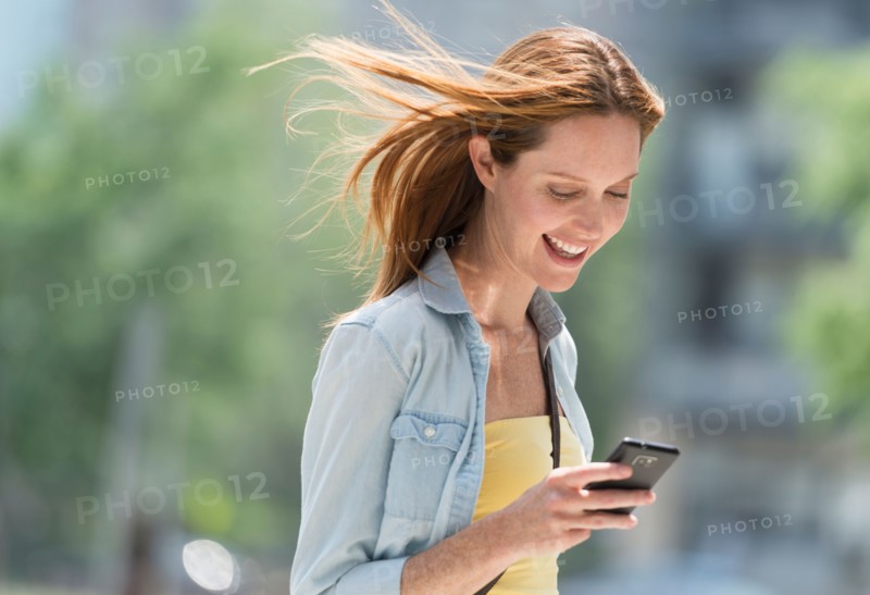 Woman using phone.
