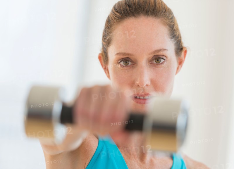 Woman exercising with weights.