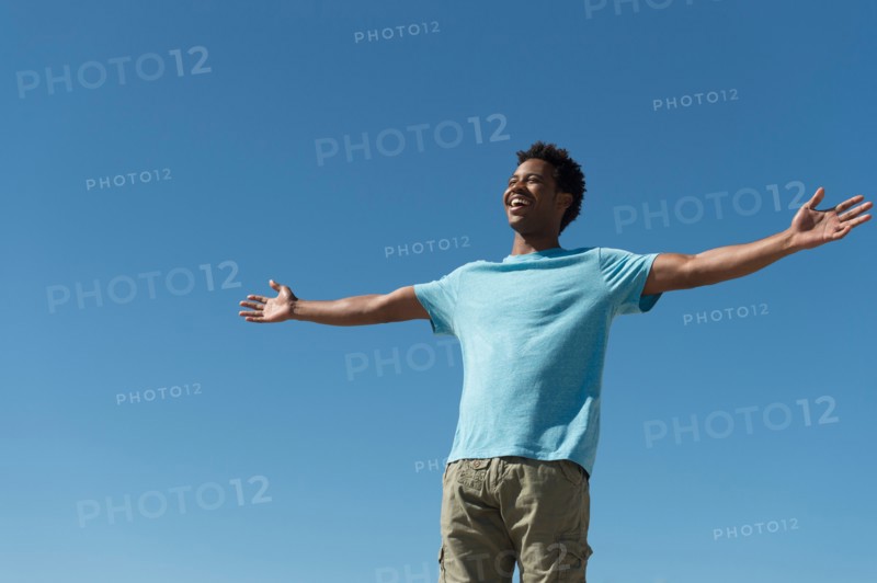 Happy man against clear sky.