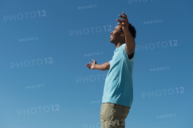 Happy man against clear sky.