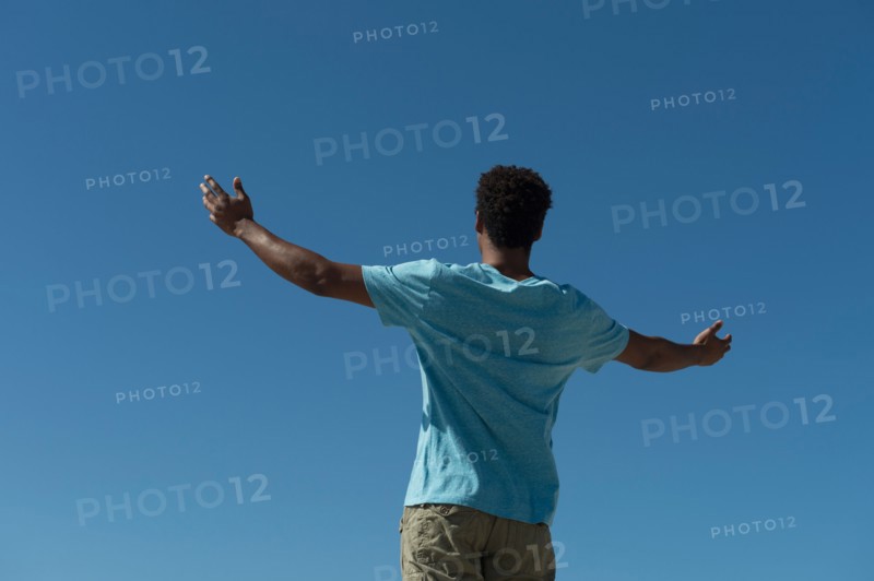 Happy man against clear sky.