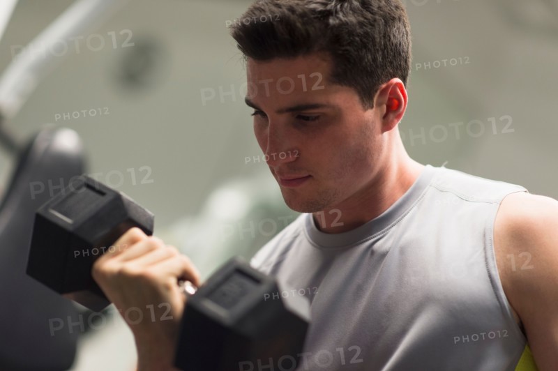 Man lifting dumbbells.