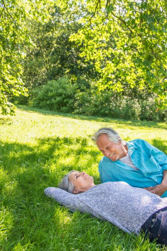 Central Park, New York City. Senior couple relaxing in park.