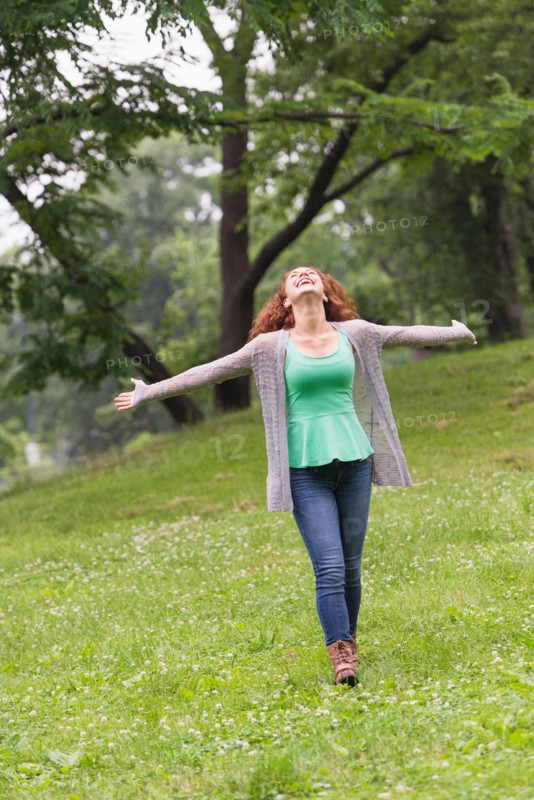 Central Park, New York City. Woman relaxing in park.