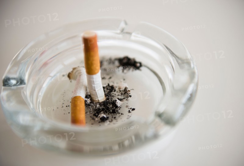 Studio Shot of cigarette butts in ashtrey