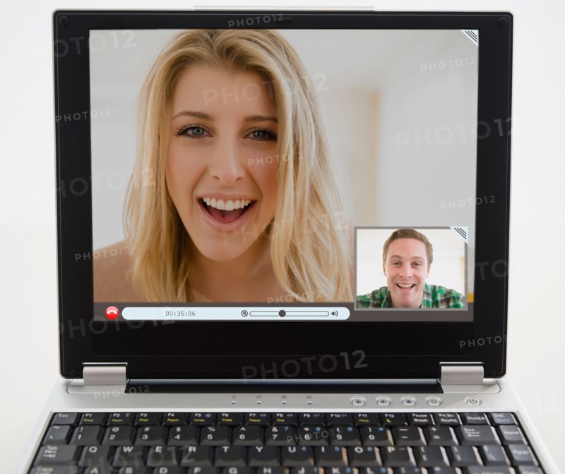 Man and woman chatting on computer