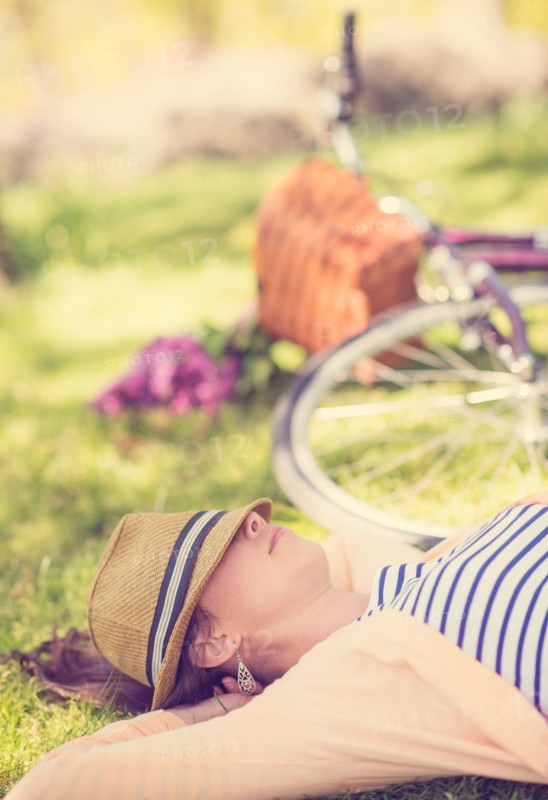 Portrait of mid adult woman relaxing in park