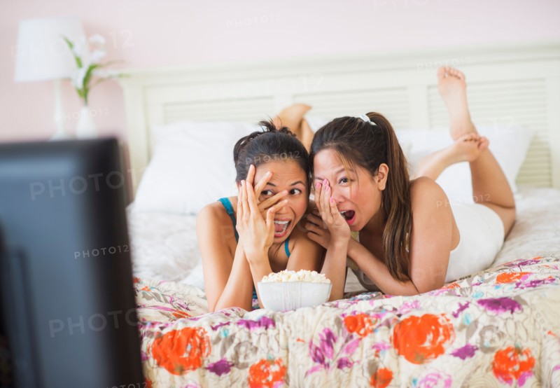 Two women watching tv