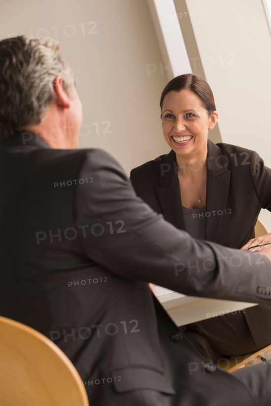 Mature man and woman working together