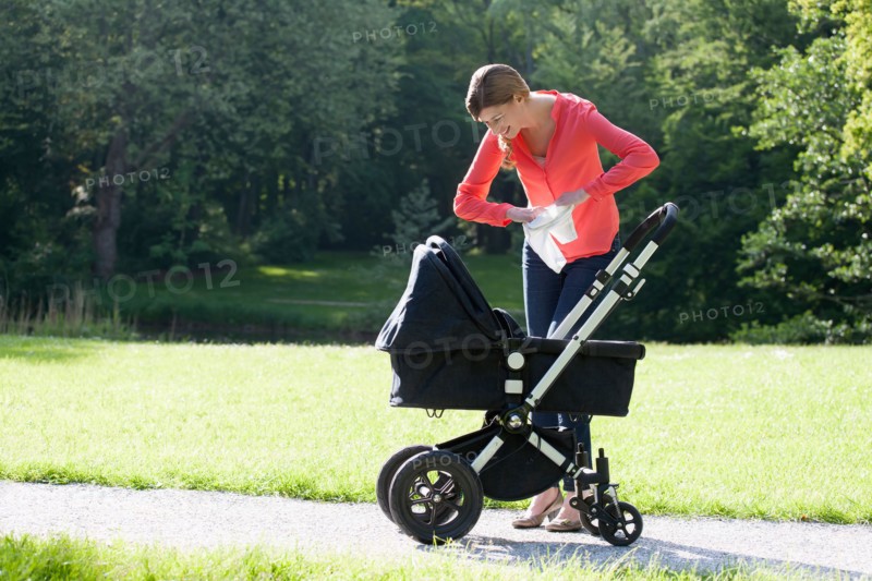 Mother with pram in park
