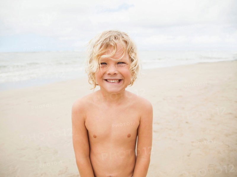 Portrait of boy (6-7) on beach