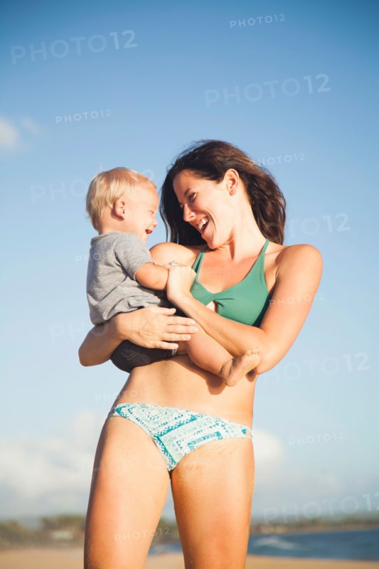 Mother with baby boy (6-11) in arms