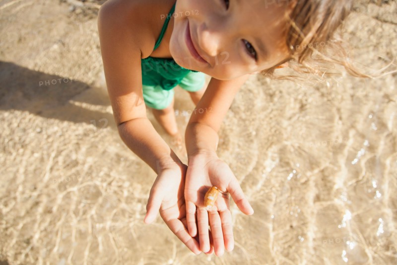 Girl (6-7) playing on beach