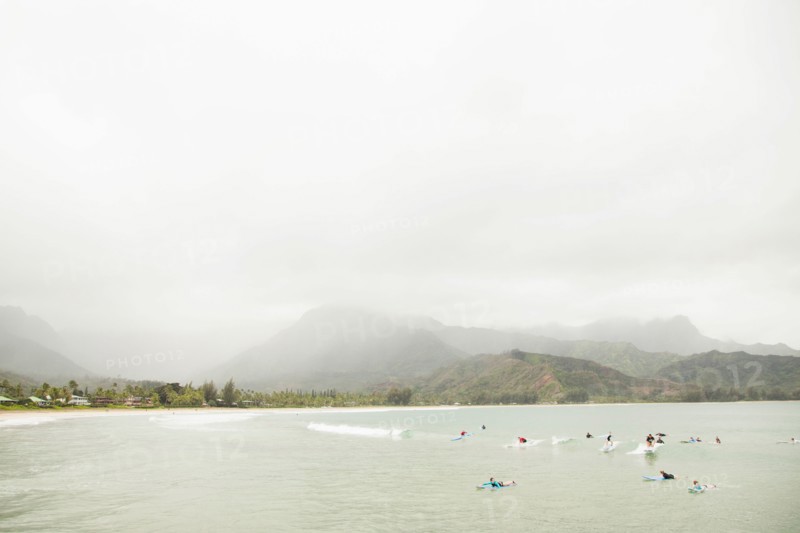 People swimming in bay