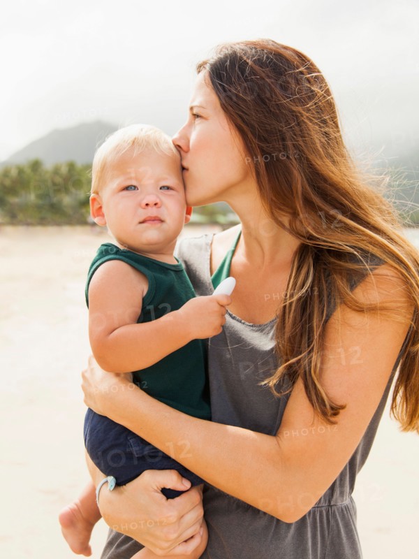 Young mother with baby daughter (6-11 months)