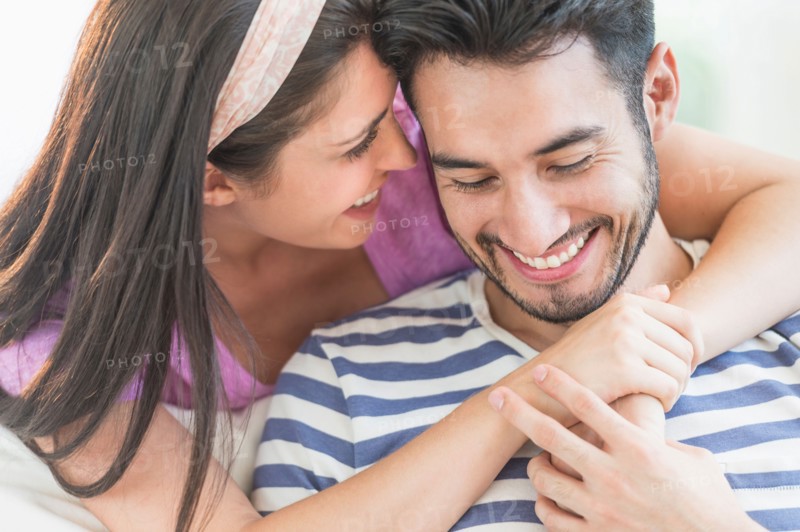 Young couple embracing.