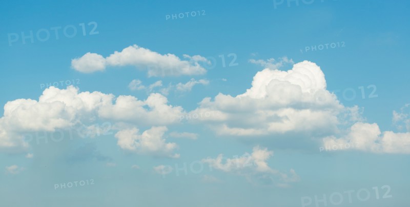 Puffy clouds on blue sky.