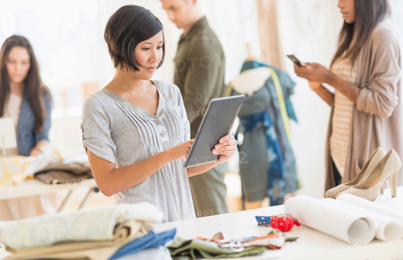 Young fashion designers working in studio.